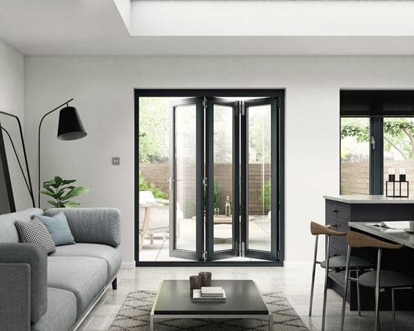 Black industrial style bifold doors in a monochrome room