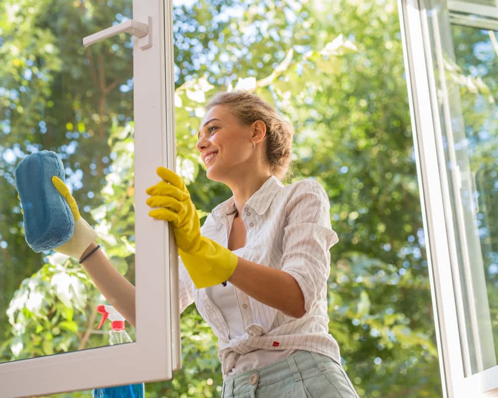 A woman cleaning windows