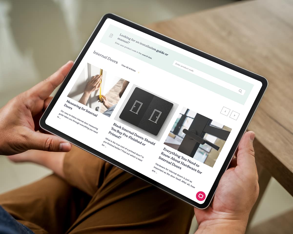 Person using the Aspire Doors help and advice page on an ipad